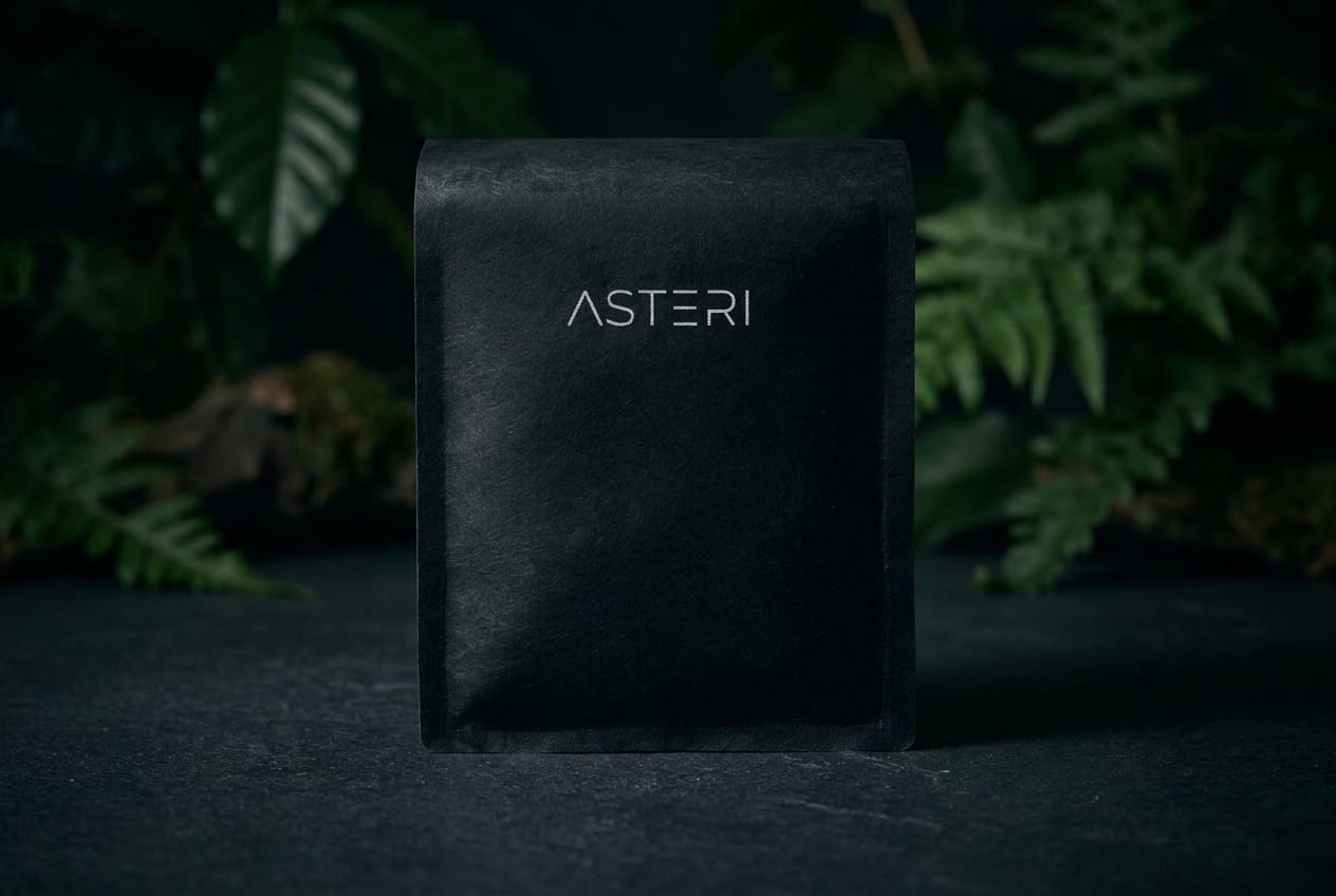 Asteri Black Label bag with silver 87+ emblem beside bowl of blueberries and sprig of lavender